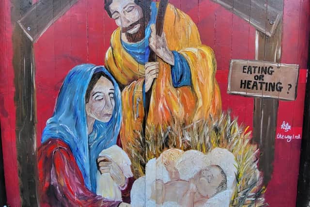 Kirsty Rea painted a topical Christmas mural on her back gate to brighten up her neighbourhood.