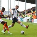 Preston North End striker Emil Riis shields the ball from Blackpool's Marvin Ekpiteta