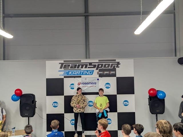 The Race Academy’s most improved cadet Katlin and most improved junior Liam with their awards