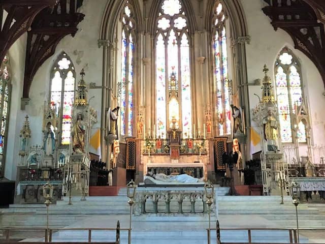 The sanctuary of St. Walburge's Church, with the nave altar - installed in 1972 - to the front and the longstanding high altar to the rear (image: Kepczyk Pearce Sanderson, via Preston City Council planning portal)