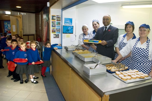MP Mark Hendrick during a visit to Holy Family Catholic Primary School where the catering team won an excellence award. They are (pictured from left) Hazel Bradshaw, Rachel Dixon, Kim Summers and Vicki Nagy, as some of the youngest students line up for their food