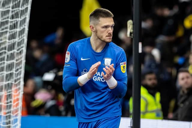 Freddie Woodman applauds the travelling supporters at the end of the match