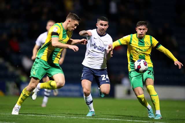 Preston North End's Sean Maguire competes with West Bromwich Albion's Dara O'Shea and Taylor Gardner-Hickman.