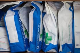 Pharmaceuticals and prescriptions awaiting collection are seen inside a independent chemist shop. 