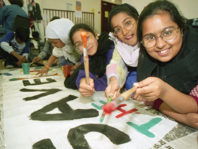 Community groups from one Preston area joined together to raise awareness about the links between poor health and environment. The Green and Healthy Avenham Day was a joint initiative between the Guild Community Healthcare NHS Trust, Lancashire County Council, Preston Council and the Avenham Ward Community Forum. Pictured: Farhana Munshi, 10, Humera Hassenjee, 10, and Nafisa Motara, 10, from Frenchwood CP School ready to paint their banner during the event
