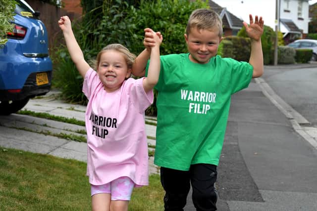 Liam and his sister Maisie with their Warrior Filip T-shirts