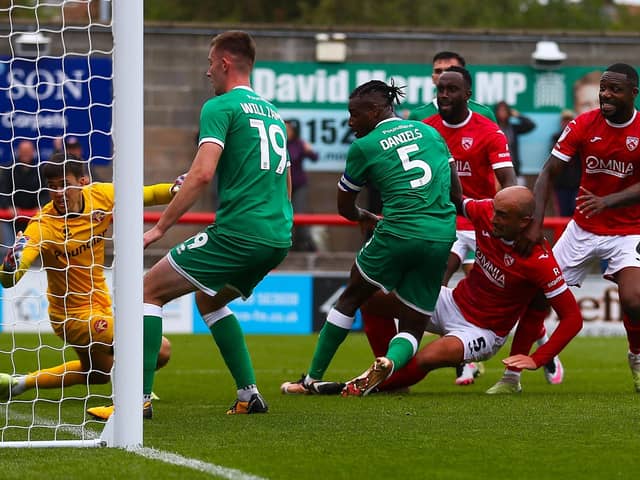 Farrend Rawson (second right) made a welcome return for Morecambe's win last weekend Picture: JACK TAYLOR