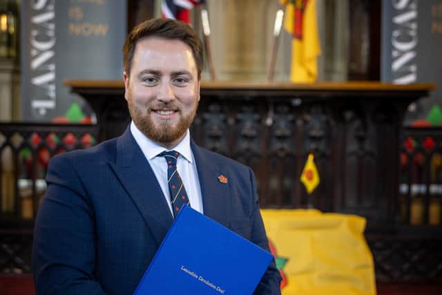 Levelling Up Minister Jacob Young MP clutching a precious cargo from the capital - Lancashire's long-awaited devolution deal