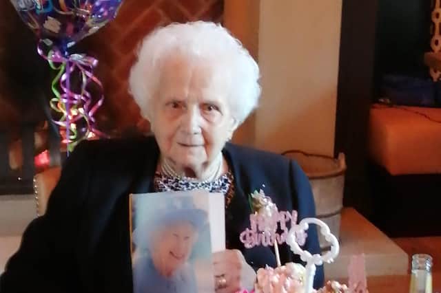 Margaret Podmore celebrating her 100th birthday at Ye Horns Inn, Goosnargh. Margaret is pictured holding a congratulations card from the Queen.