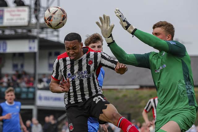 Kole Hall challenges for a aerial ball against Marine (photo: David Airey/dia_images)