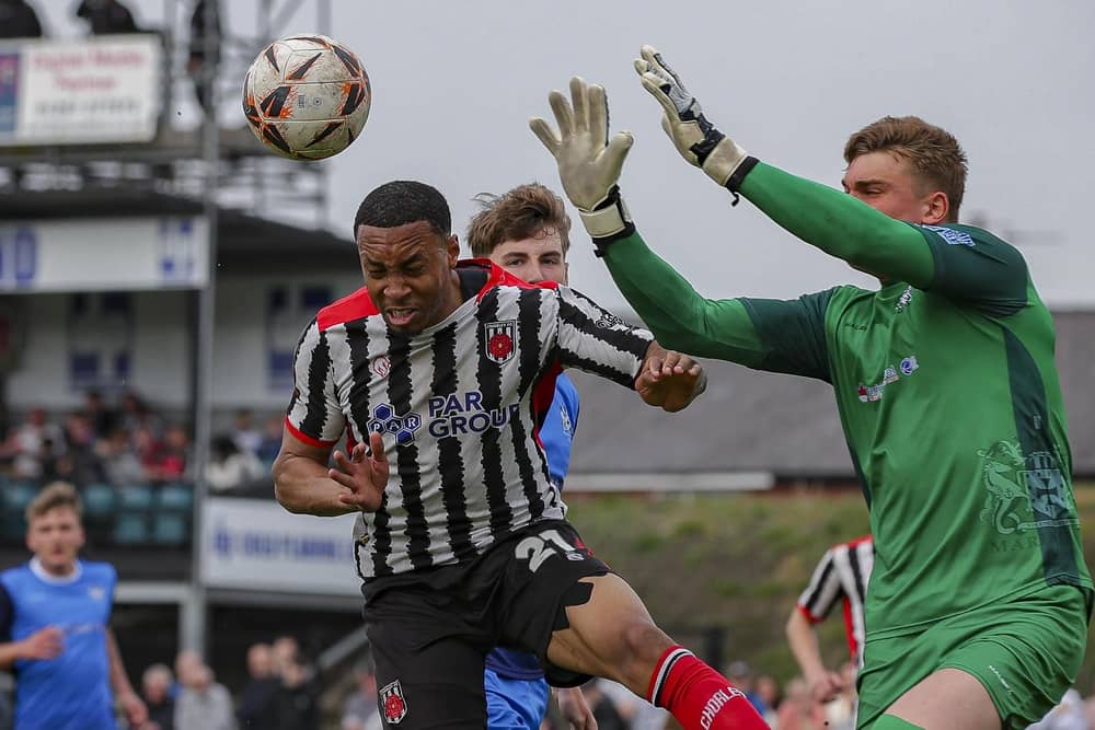 Kole Hall challenges for a aerial ball against Marine (photo: David Airey/dia_images)