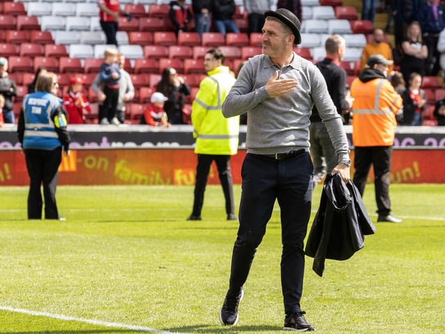 Ryan Lowe celebrates wearing a bowler hat after PNE's Gentry Day win over Barnsley