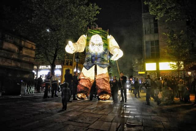 A giant roams the streets in the 2017 Brief Encounter Festival.