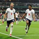 Harry Kane #9 of England celebrates with Jude Bellingham #10 after converting a penalty for his team’s third goal during the FIFA World Cup 2026 Round of 16 match between Mexico and England at Mexico City Stadium on July 05, 2026 in Mexico City, Mexico. (Photo by Charlotte Wilson/Getty Images)