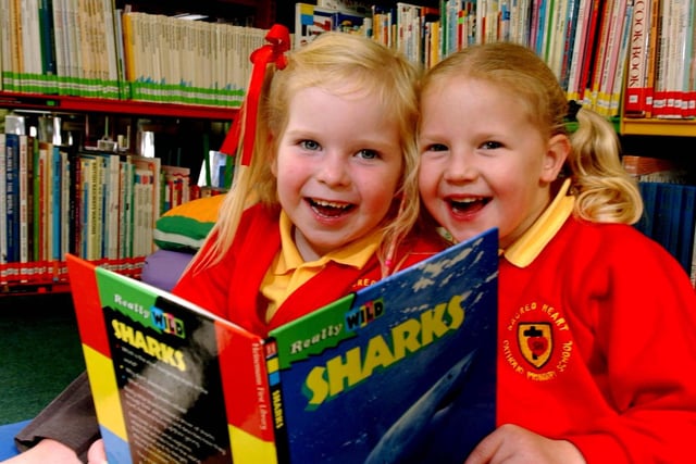 Megan Hirst and Emily Hitchmough in the new library at Sacred Heart Primary School in Preston
