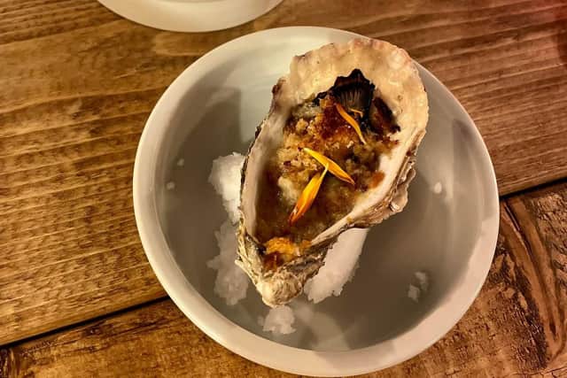 Course 2: Bunuelo de Ostras: Grilled Oyster, Apricot and Walnut. Wine: Raimat Chardonnay.