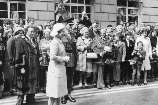 Cameras at the ready as the crowd eagerly takes pictures of the Queen's visit to Preston in 1977