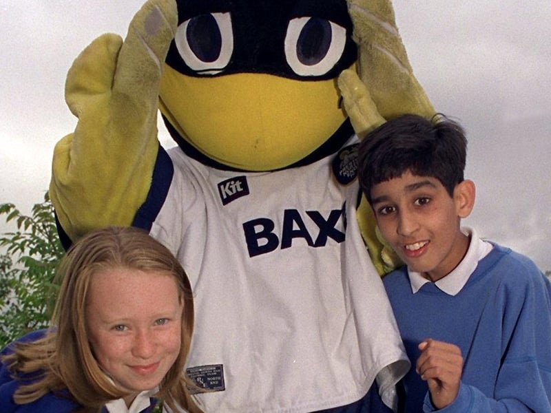 Deepdale Duck meets the challenge from Emma Shaw,11, and Anand Patel,11, during the Preston North End Road Show at Sherwood County Primary School