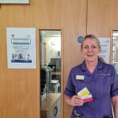 Lead chemotherapy acute oncology nurse specialist Jo Wilkinson with new alert cards funded by  Rosemere Cancer Foundation