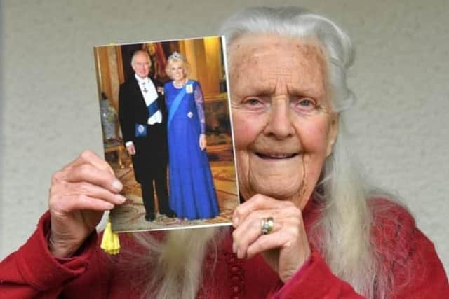 Violet with her 100th birthday card from King Charles and Queen Consort Camilla