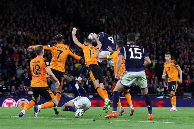 Alan Browne challenges for a header and is penalised for handball.
