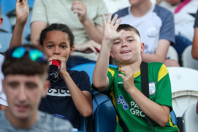 Two young PNE fans wave to our photographer.