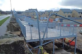 The housing developer responsible for constructing a metal walkway, that has been blasted as a ‘monstrosity’ on a new housing estate in Burnley, has said today it is still in the ‘early stages of construction.’