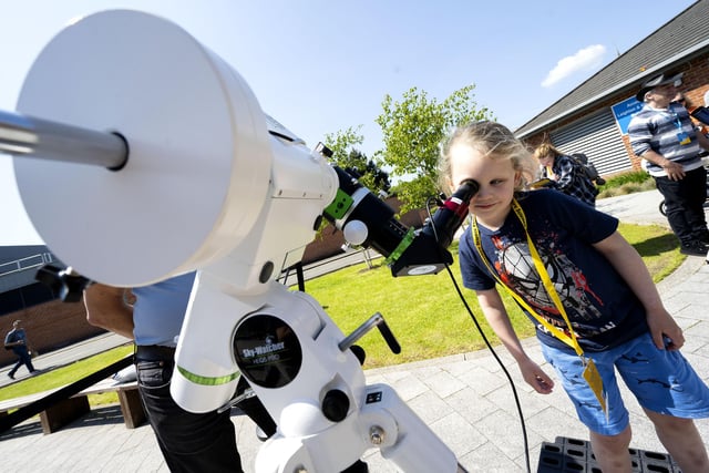 Christian Unsworth, 5, from Chorley looks through a telescope.