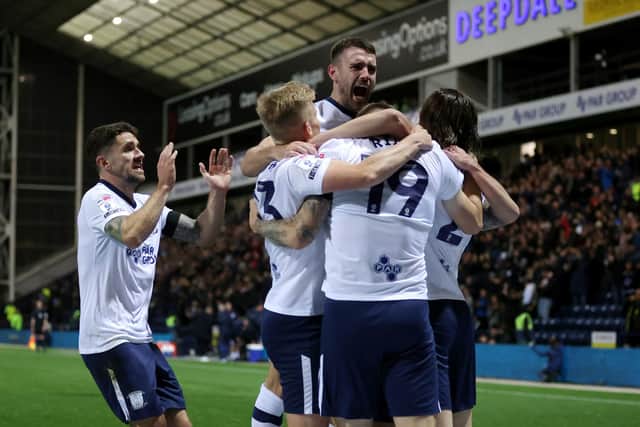 Preston North End players celebrate the opening goal scored by Emil Riis to make the score 1-0.