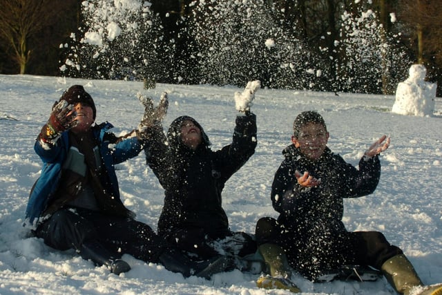 Adam and Scott Fisher with Kieran Lowe enjoy the snow in Penwortham