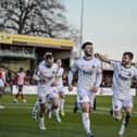 Connor Barratt celebrates with team-mates after opening the scoring at Altrincham