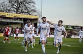 Connor Barratt celebrates with team-mates after opening the scoring at Altrincham