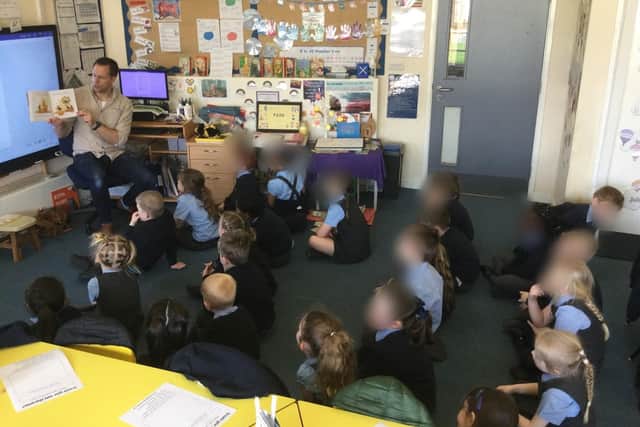Matt reading his book 'Beyond the Hive' to children from Freckleton C of E