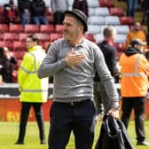 Preston North End's manager Ryan Lowe wearing a bowler hat 