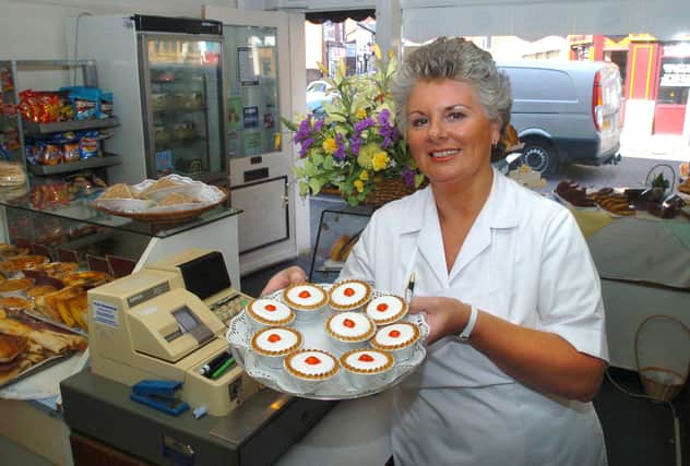 Pictured at Perfectionery the cake bread and bun shop on Sharrow Vale Road, Sheffield, which  has been trading for 20 years in 2006. Seen is  Lynda Barber in the shop with cherry bakewells.