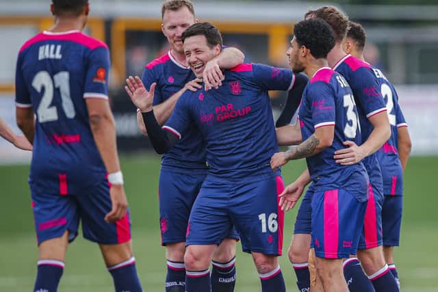 Adam Blakeman (No.16) is congratulated after his stunning free kick (photo: David Airey/dia_images)