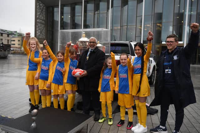 The Mayor of Preston, Coun Javed Iqbal with young rugby players who had come down to see the trophies.