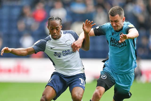 Preston North End's Daniel Johnson battles with Millwall's Murray Wallace