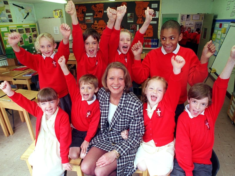 Something to cheer about... Howick CE Primary School headteacher, Lesley Maddock, with class representatives, front row, from left, Lorna Kellett, five, Joseph Whitingham, five, Rella Critchley, five, and Sam Pratt, seven, back row, from left, Kate Harrison, nine, Daniel Peters, eight, Jenny Harrison, eight, and Marcus Alty, 10, celebrate their excellent Ofsted report at the school at Howick, Penwortham, near Preston