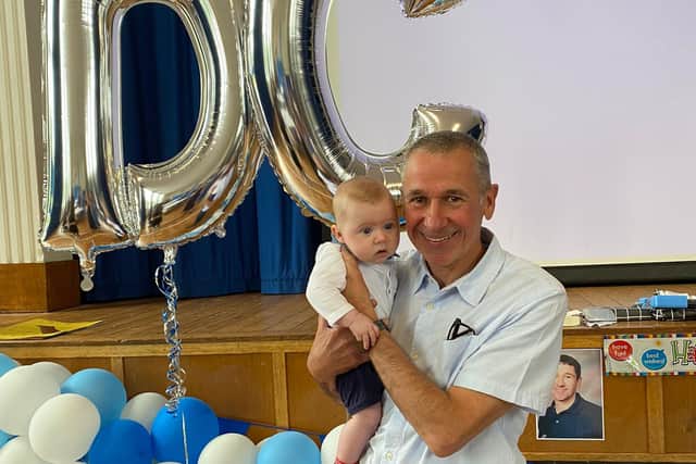 Damien with one of his grandchildren at his leaving do last week.