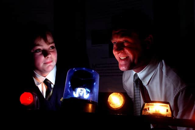 Thirteen-yearold Ribbleton Hall High School pupil Tracey Gent discovers the facts behind council vehicle lights from Lancashire County Engineering Services contracts manager Steven Monks during the opening of the Industry 2000 roadshow at the school in 1997