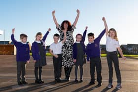 Pupils from Trinity School in Buckshaw Village celebrate their school receiving a good rating from Ofsted with head teacher Mrs Jill Wright.