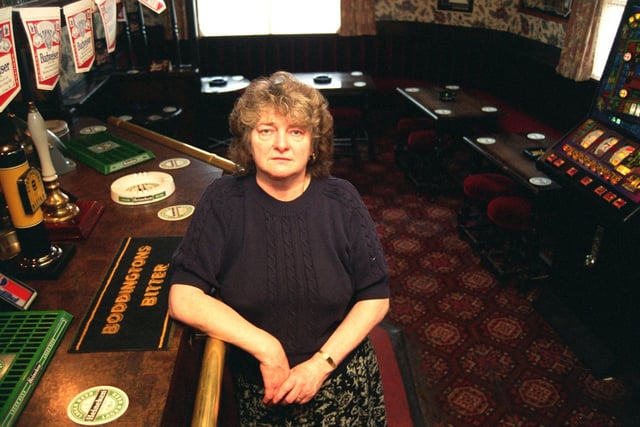 This image shows the decline of Meadow Street as Norma Robinson, licensee of the New Fleece pub, sits in her empty bar