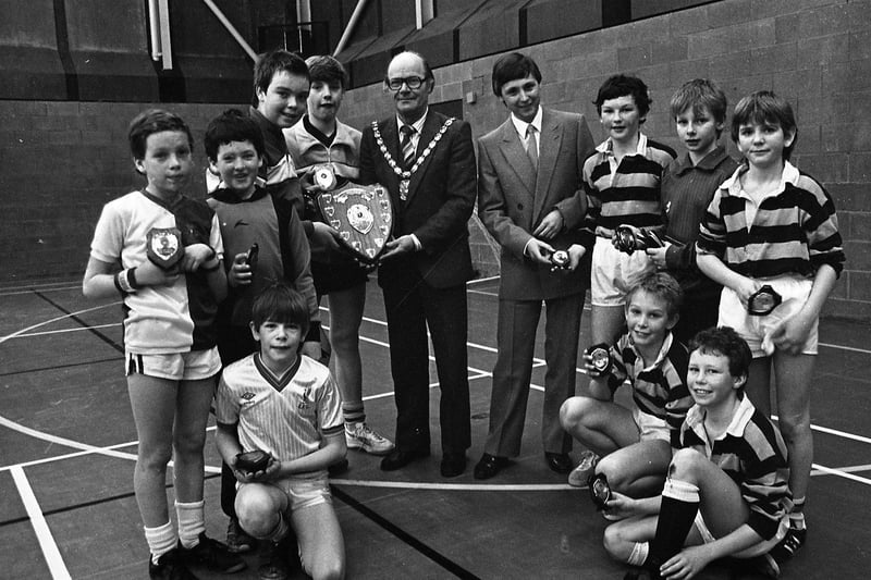 Bamber Bridge LC won the boys five-a-side soccer competiton at Leyland. They are pictured above left receiving their trophies from the Mayor of South Ribble, Coun Gordon Thorpe. Mr Terry Walton, of Besglos Polish (right), presented the runners up, Penwortham LC, with their awards. Bamber Bridge won 3-2.