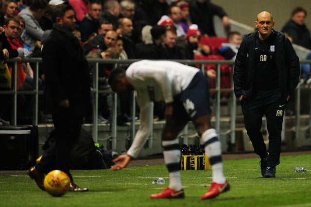 Preston North End manager Alex Neil watches on as Darnell Fisher takes his time over a throw in.