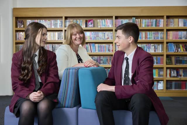 St Michael’s CE High School is celebrating a 'good Ofsted report. Pictured: Mrs Jenks (Headteacher) with Headboy and Headgirl