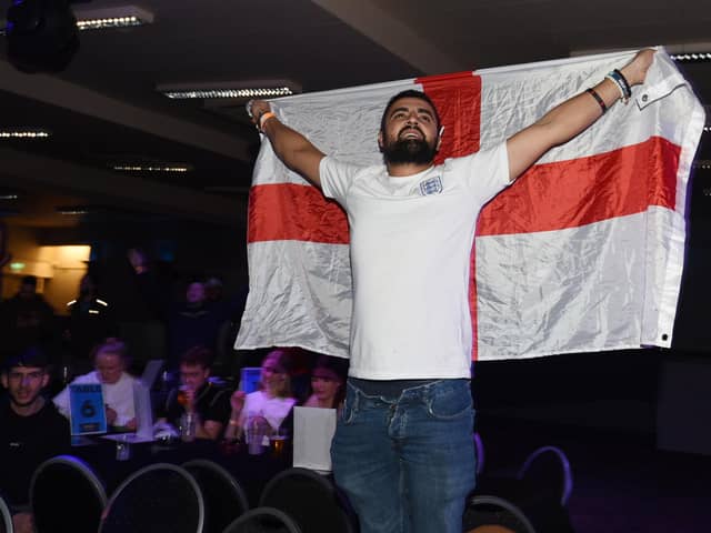 A happy crowd as football fans watch England win 3-0 against Senegal in Round 16 of the World Cup 2022, pictured watching the match at World Cup Fanzone at Riva Showbar, Preston.