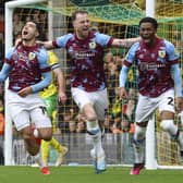 Burnley's Anass Zaroury (left) celebrates scoring the opening goal with Ashley Barnes and Nathan Tella at Norwich City last week