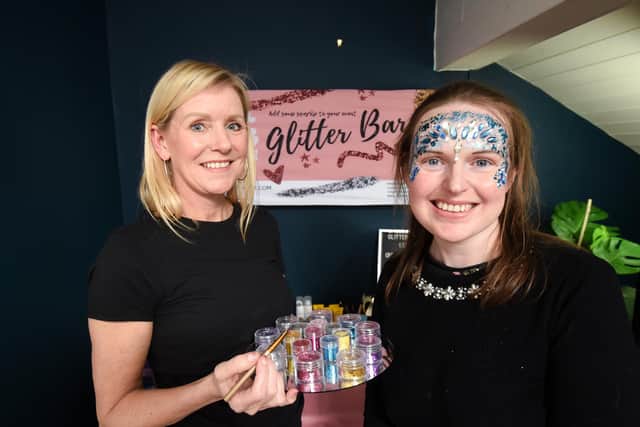 Reporter Lucinda Herbert gets glitter make up from award winning make up artist Nicola Miller