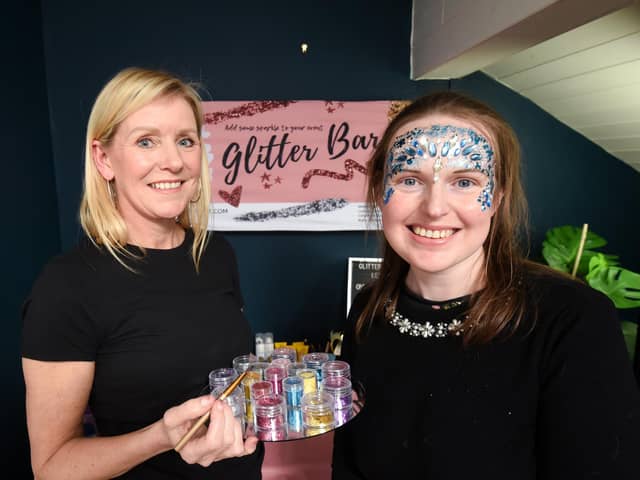 Reporter Lucinda Herbert gets glitter make up from award winning make up artist Nicola Miller